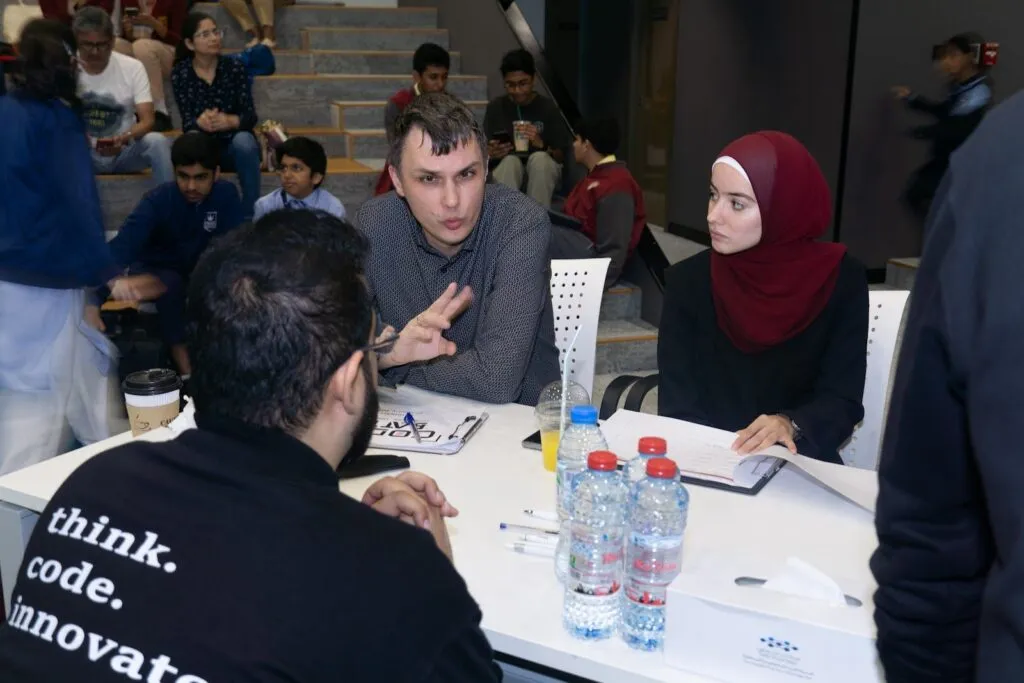 Judges question a student team at the Code Battle 2023 national final
