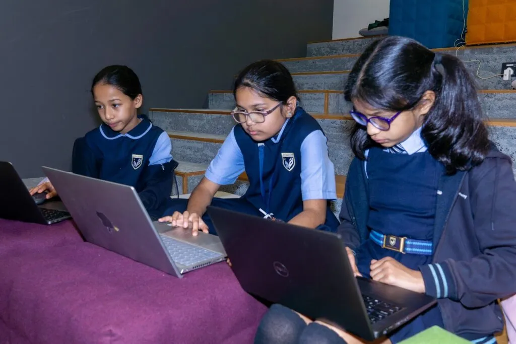 Young students code on laptops at the Code Battle 2023 national final in Dubai