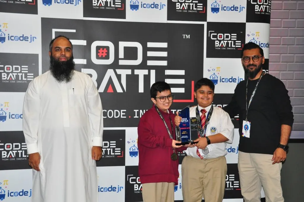 A winning team holds its trophy at the Code Battle 2024 awards