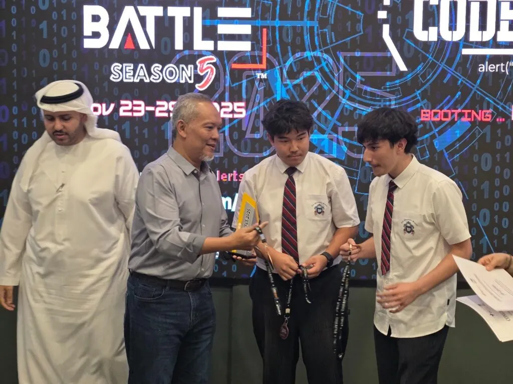Grades 9–12 students receive their medals at the Code Battle 2025 awards