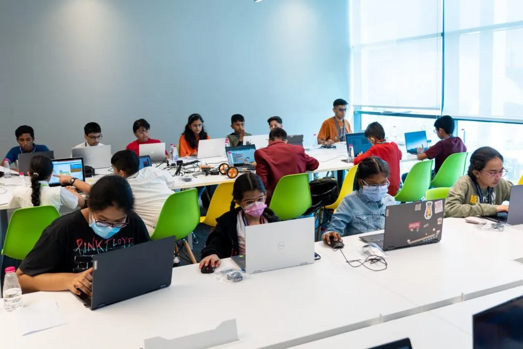 Children code on laptops at CodeNova, iCodejr's kids' hackathon at the Sharjah Entrepreneurship Festival 2022